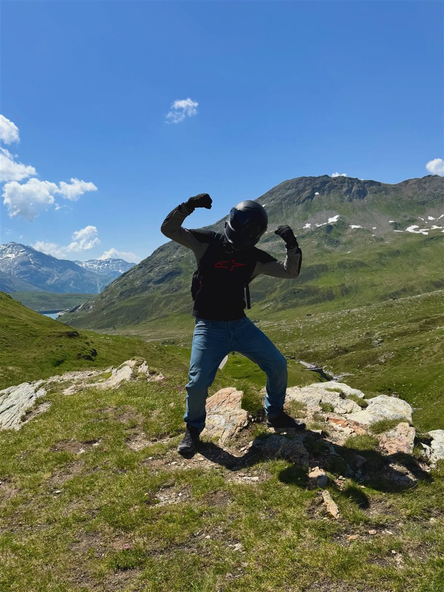 Edoardo in motorcycle gear on an alpine pass